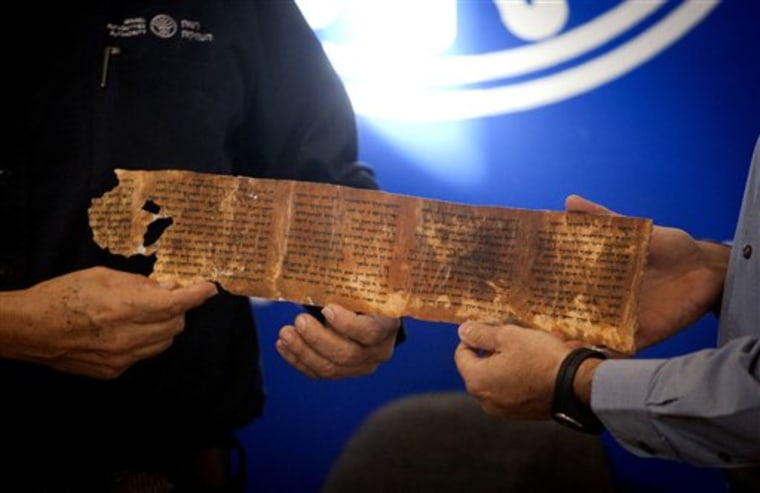 A copy of a part of the Dead Sea Scrolls is presented during a joint Israel Antiquities Authority-Google news conference in Jerusalem on Tuesday. Israeli authorities have put 5,000 fragments of the ancient Dead Sea scrolls online in a partnership with Google.